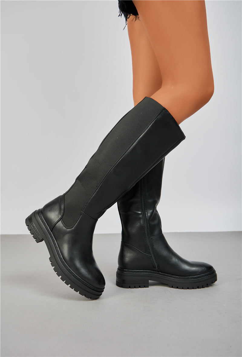 Bottes noires à semelle crantée bi-matière
